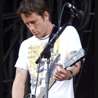 Chris Shiflett playing guitar on stage