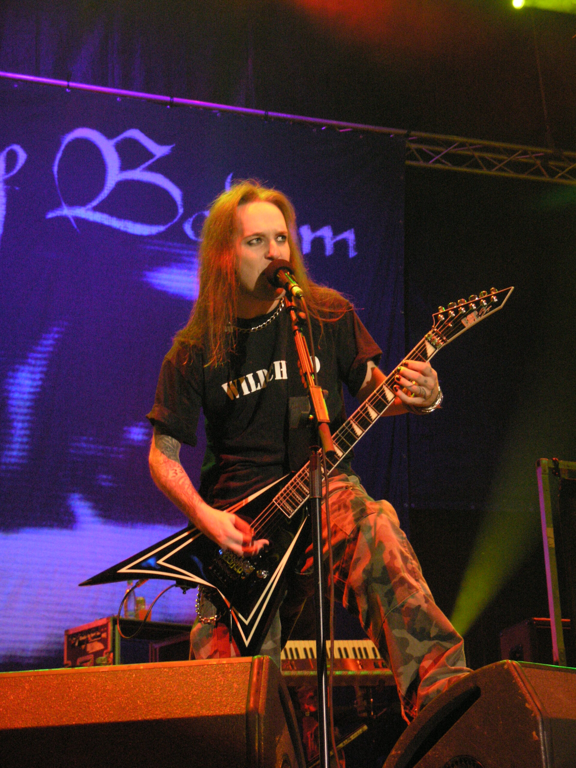 Alexi Laiho playing a black ESP custom with white pinstripes at Masters of Rock, 2007.