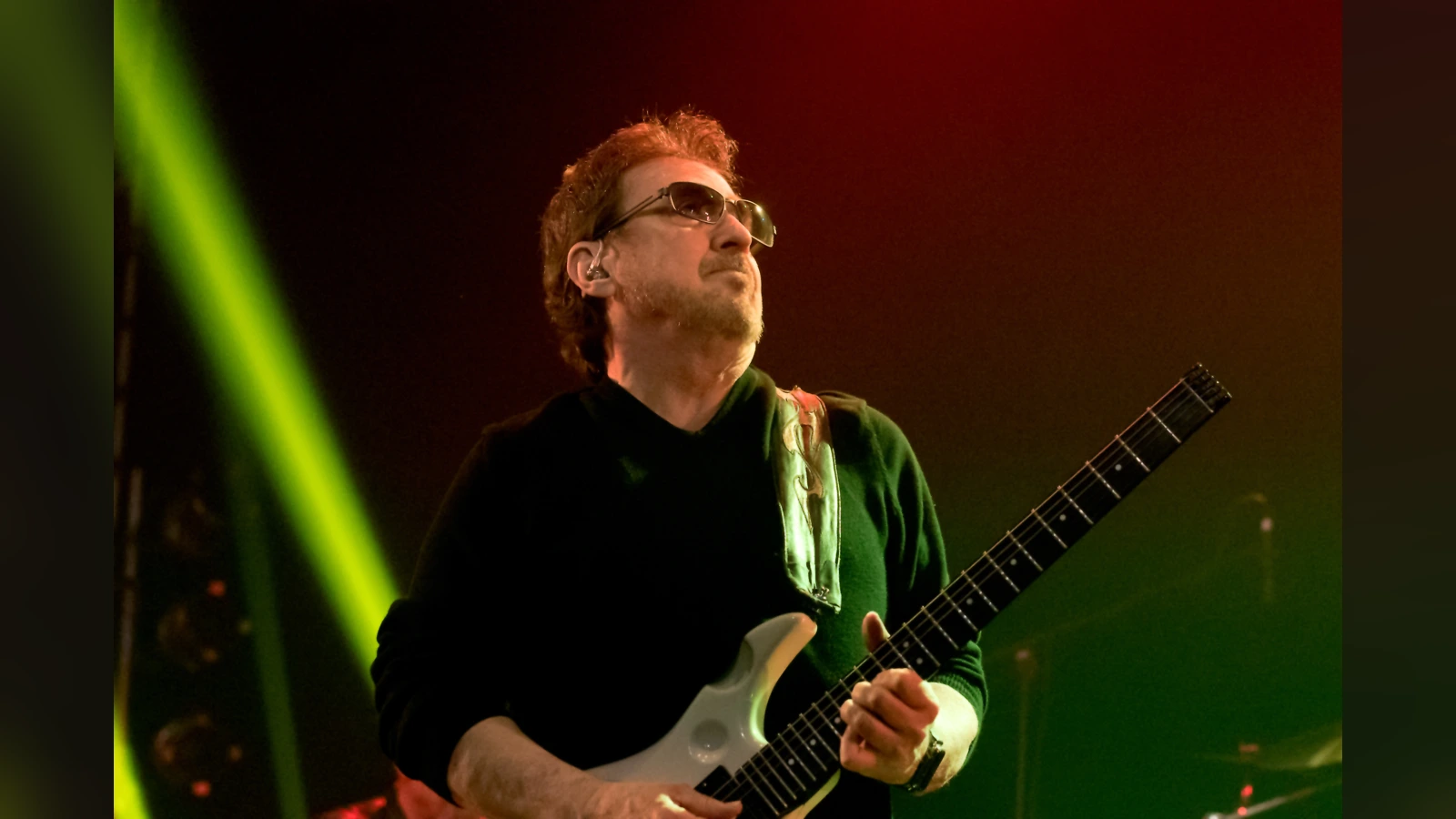 Buck Dharma playing his guitar at Wacken Open Air in 2016; the lower guitar body is outside the original frame.