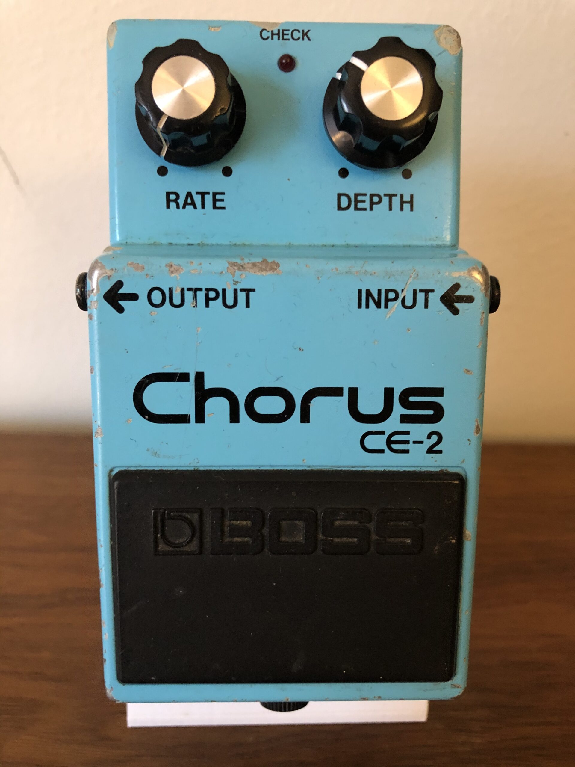 Complete worn blue Boss CE-2 Chorus pedal with Rate and Depth controls.