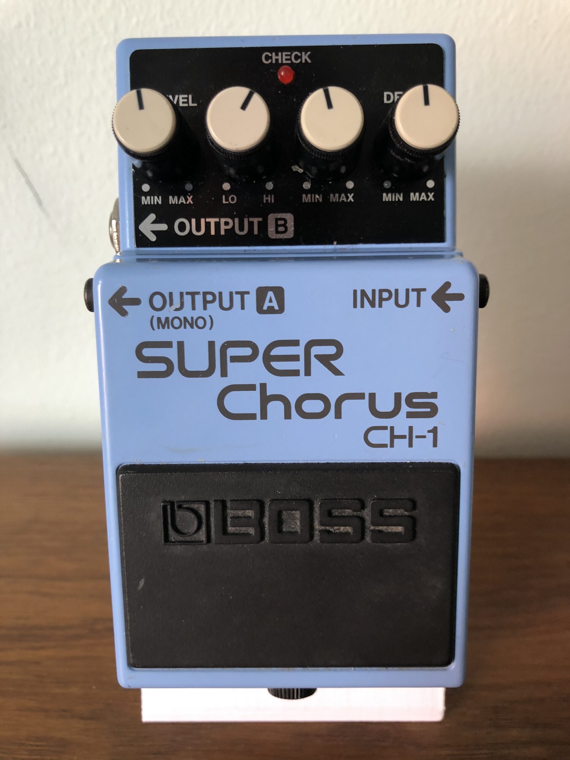 Complete blue Boss CH-1 Super Chorus pedal with four knobs, two output jacks and visible model lettering.