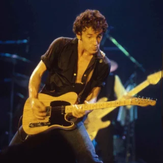Bruce Springsteen playing a blonde electric guitar at New Haven Coliseum, circa 1977–1978