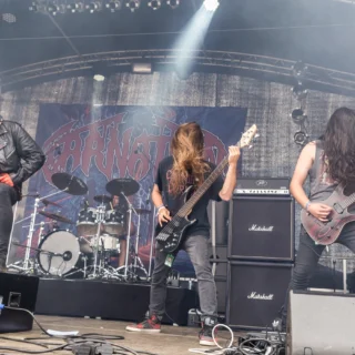 Carnation onstage at Summer Breeze in 2017, with vocalist, bassist, guitarist and drummer visible.