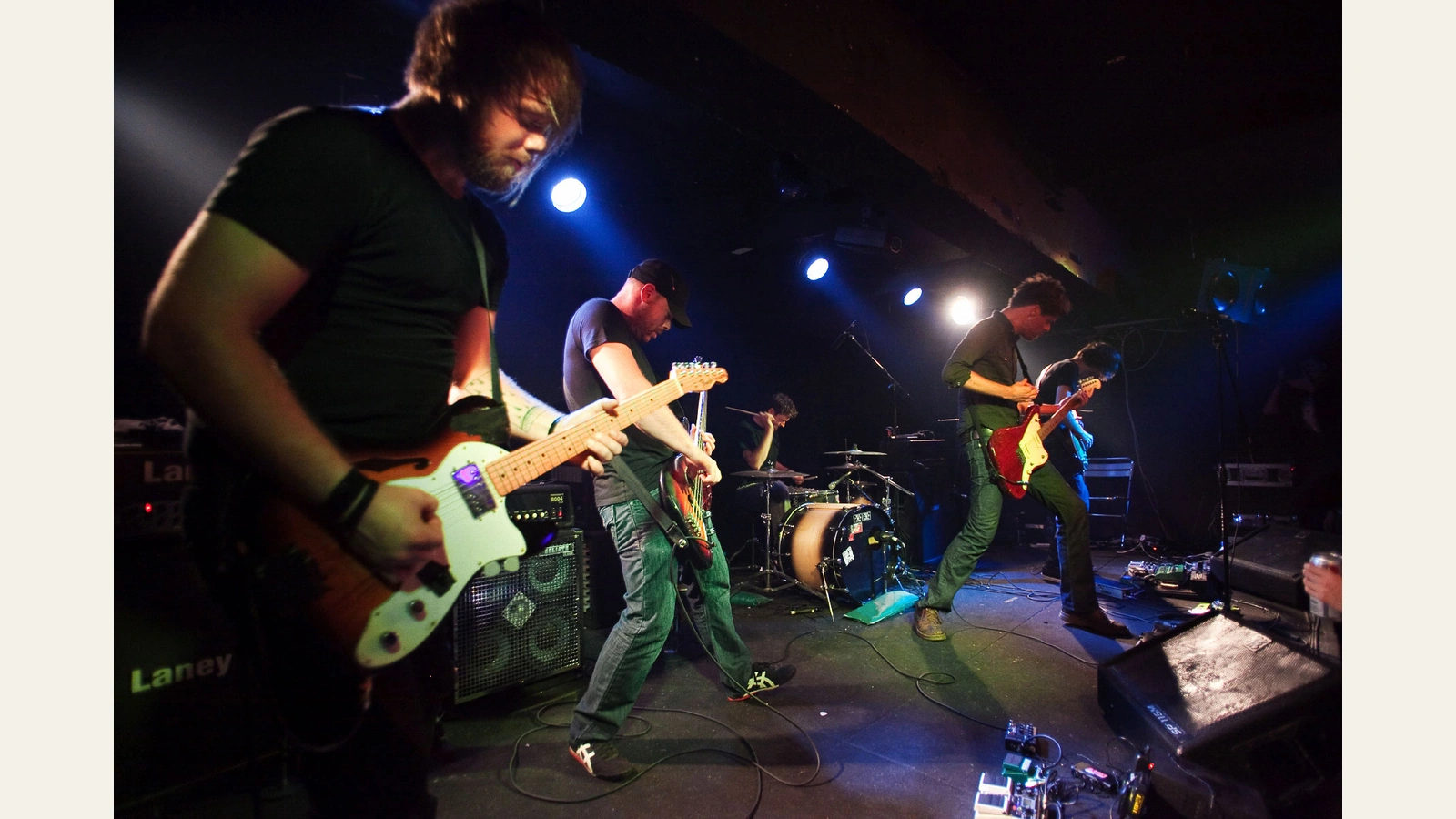 Caspian’s five-member 2010 lineup performing onstage at Hidden Agenda in Hong Kong, with guitars, bass and drums.