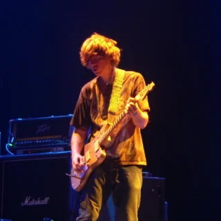 Thurston Moore playing guitar with Sonic Youth at Roskilde Festival in 2005