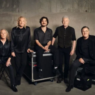 Five members of Eagles in the official portrait supplied with the Sphere announcement.
