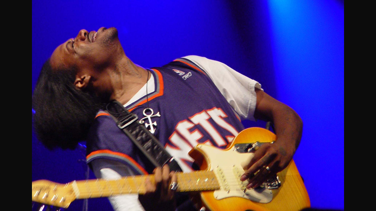Eric Gales leaning back while playing an electric guitar onstage, Netherlands, 2006.