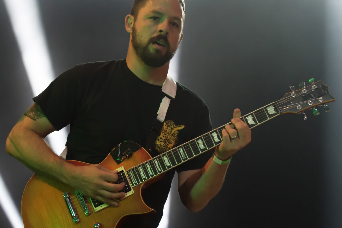 Ben Weinman playing an amber-finished LTD EC-1000 at Wacken Open Air in 2017, with the complete guitar and headstock visible