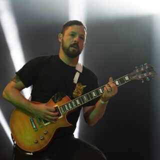 Ben Weinman playing an amber-finished LTD EC-1000 at Wacken Open Air in 2017, with the complete guitar and headstock visible