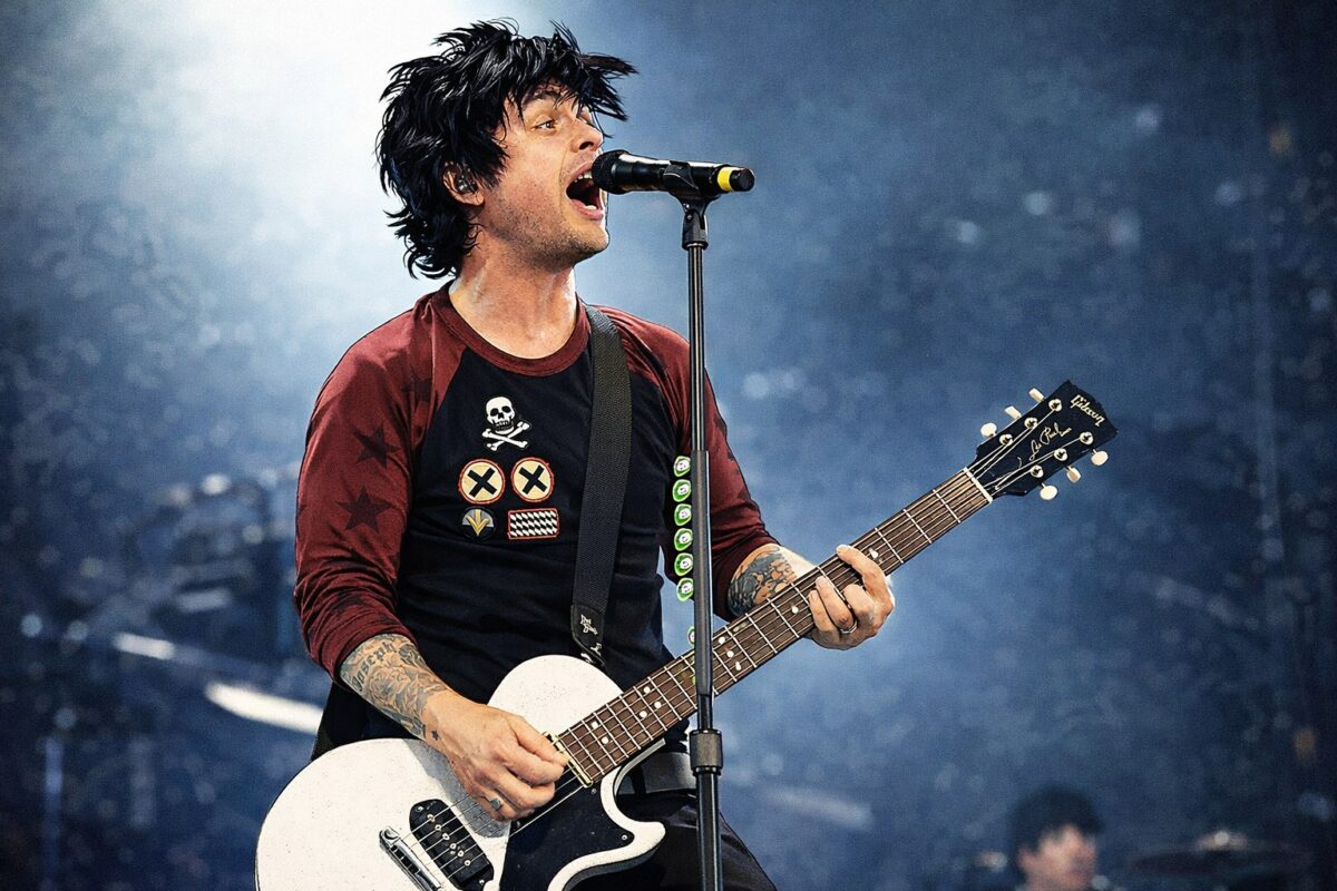 AI-generated illustration: Billie Joe Armstrong singing with a white Les Paul Junior-style guitar.