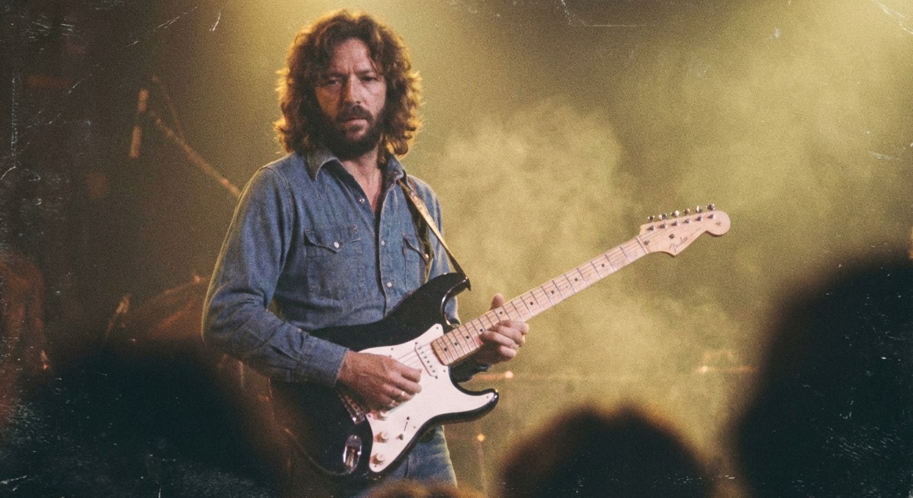 AI-generated illustration: Eric Clapton on stage with a black Stratocaster.