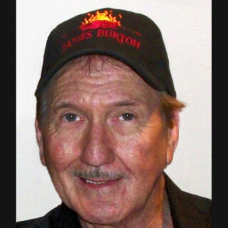 Portrait of James Burton wearing a black cap in Verona in November 2010