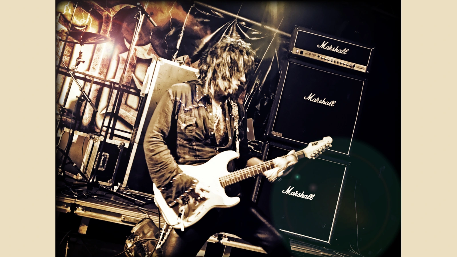 Joe Stump playing a white guitar at R-Mine Metalfest in Belgium in 2013.