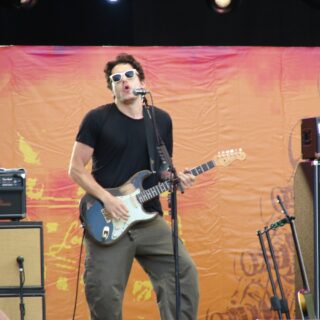 John Mayer on stage with a Fender Stratocaster in 2009.