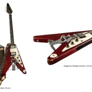 Lonnie Mack’s red Gibson Flying V with Magnatone amplifier and stage strap, alongside a guitar body detail