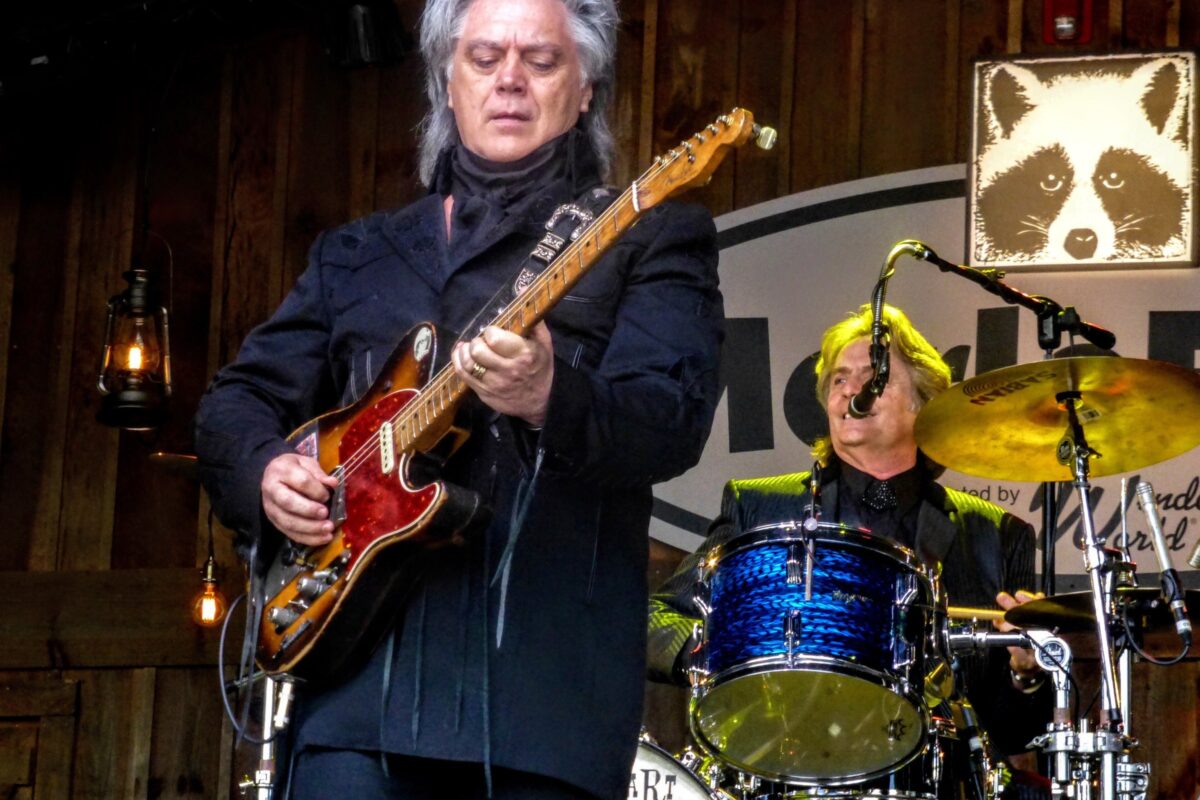 Marty Stuart playing guitar at MerleFest in 2017.