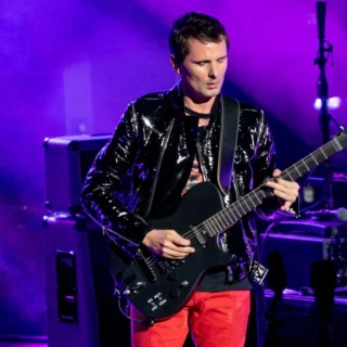 Matt Bellamy playing a black Manson guitar at the Royal Albert Hall in 2018.