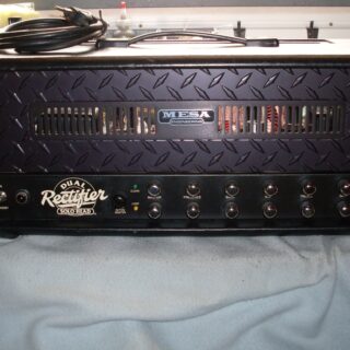 A black Mesa/Boogie Dual Rectifier Solo Head with its full enclosure, handle and two rows of controls visible.