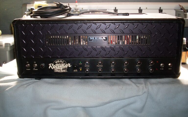 A black Mesa/Boogie Dual Rectifier Solo Head with its full enclosure, handle and two rows of controls visible.