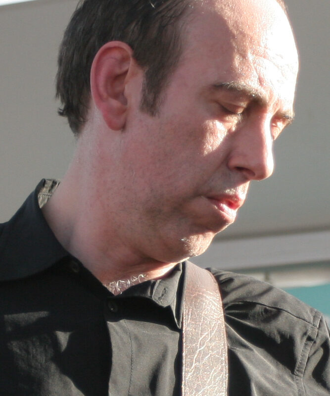 Mick Jones of The Clash, shown in a head-and-upper-torso portrait at SXSW in 2008.