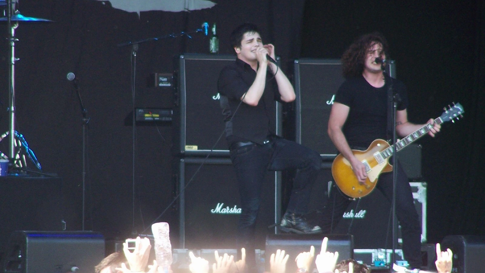 Gerard Way singing beside Ray Toro playing a sunburst electric guitar at Big Day Out in Perth in 2007.