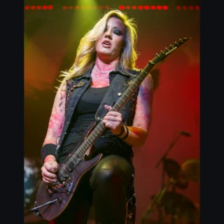 Nita Strauss playing an Ibanez electric guitar during an Alice Cooper concert in San Antonio in 2015.