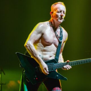Phil Collen of Def Leppard on stage at The O2 in London in 2018.