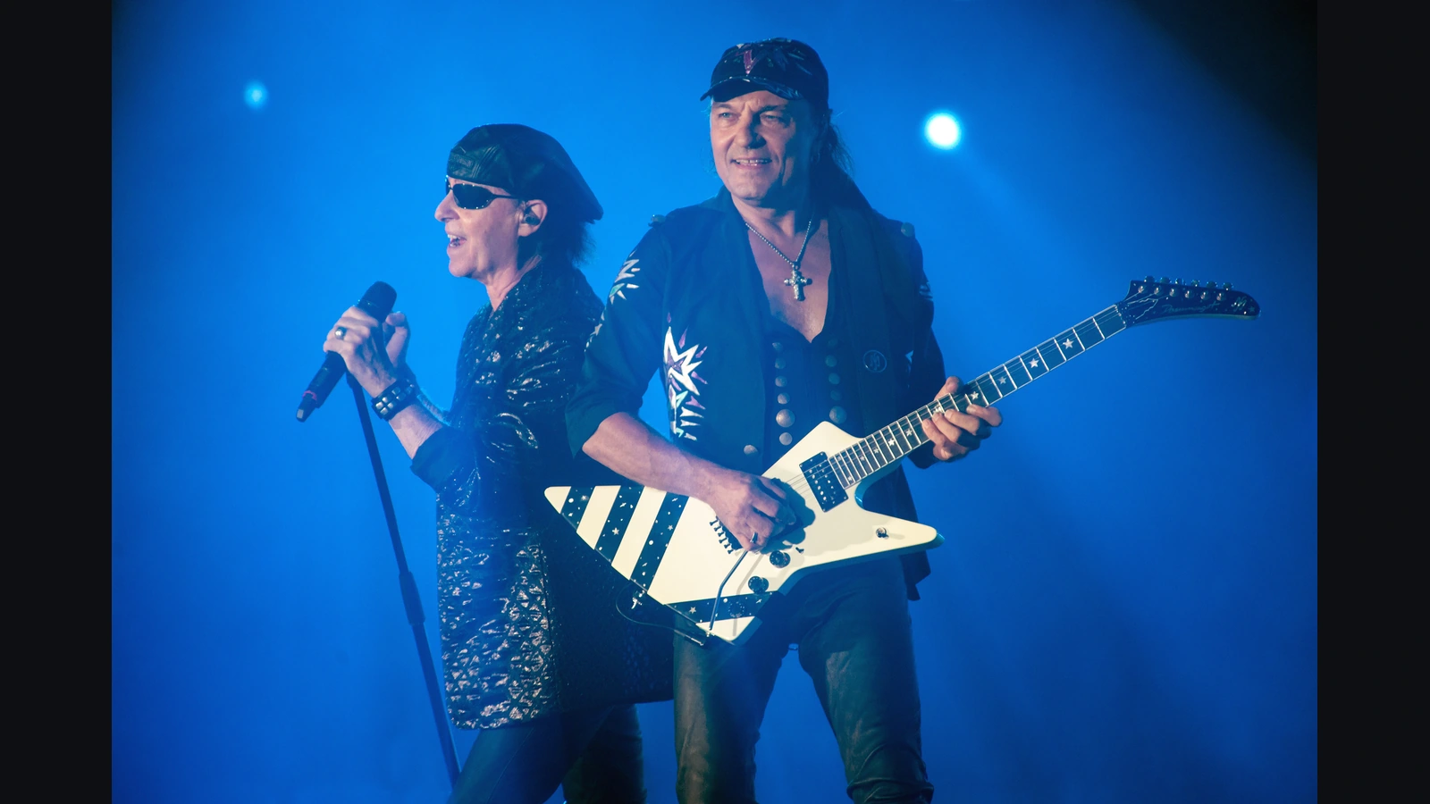 Klaus Meine and Matthias Jabs of Scorpions on stage at Hellfest in 2022; Jabs holds his white electric guitar.