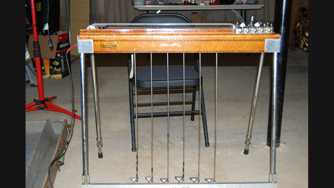 Archival 2008 photograph of a wooden Sho-Bud pedal steel guitar with its pedal rods and legs visible.