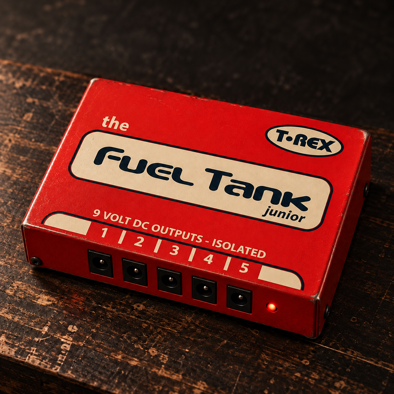 AI model illustration of a red T-Rex Fuel Tank Junior with five numbered outputs and its red indicator on the right.