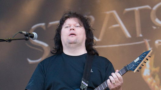 Timo Tolkki on stage, with his face and upper body visible.