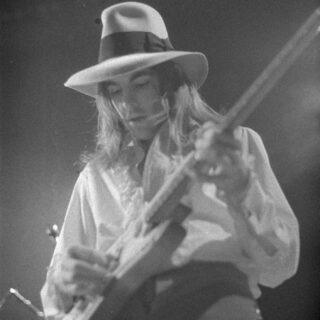 Tommy Bolin performing on stage.