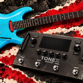 Editorial illustration of a TONEX Board processor beside a blue electric guitar.
